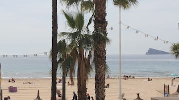 On the beach, sun-loungers