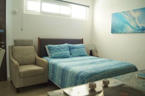 A bedroom with a bed, a chair, a desk, and a window. - Jungle vibe,  with  Sea side breezes , EXPERIENCE THE MAYAN RIVIERA  (Akumal)