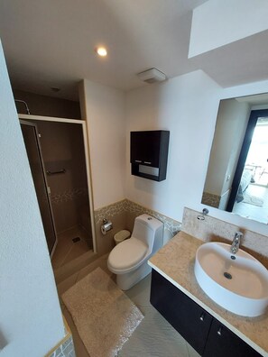 Shower, towels, soap, toilet paper