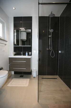 Shower, free toiletries, hair dryer, slippers