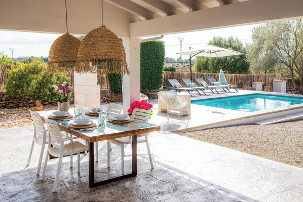 Outdoor dining - Vacation Home Santa Eulàlia 54 with Wi-Fi, A/C, Pool, Garden & Terrace; Parking Available (Can Picafort)