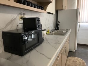 Fridge, microwave, oven, stovetop - 3 Bedroom fully furnished private condo with Free Parking & free WiFi & cable. (Chalan Pago-Ordot)