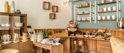 A kitchen with wooden shelves, a buffet counter, and a dining area with chairs.