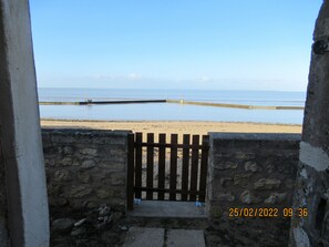On the beach, sun-loungers
