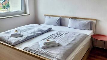 Basic Apartment | Living area | 22-inch flat-screen TV with cable channels, TV