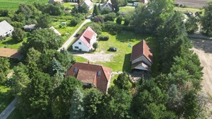 An aerial view of a rural area with houses surrounded by greenery and fields. - Vacation apartment 3 - Rügen-Fewo 155 (Bergen auf Rügen)