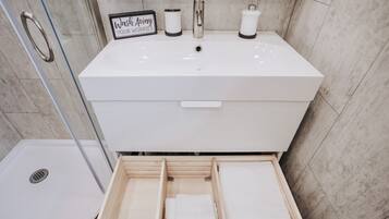 Shower, hair dryer, towels, soap