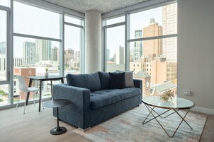 Signature Apartment, 1 King Bed with Sofa bed, Pool Access (Self Check-in with Virtual Front Desk) | Living area | 55-inch flat-screen TV with digital channels, TV