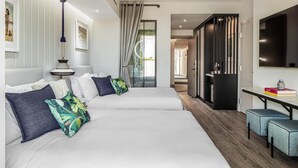 A modern hotel room with two beds, a desk, a TV, and a wardrobe. - The Ray Hotel Delray Beach, Curio Collection by Hilton (Delray Beach)