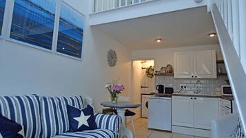 Cottage, 1 Queen Bed | Living room | 30-inch TV with digital channels