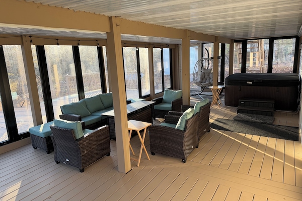 Hot Tub and sitting area and the beautiful view of the woods