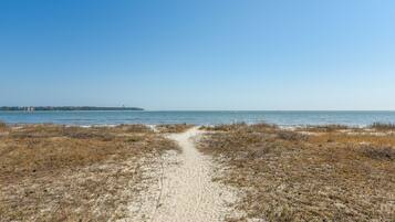 On the beach, sun loungers, beach towels