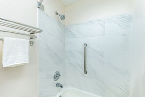 Combined shower/bathtub, hair dryer, towels, soap