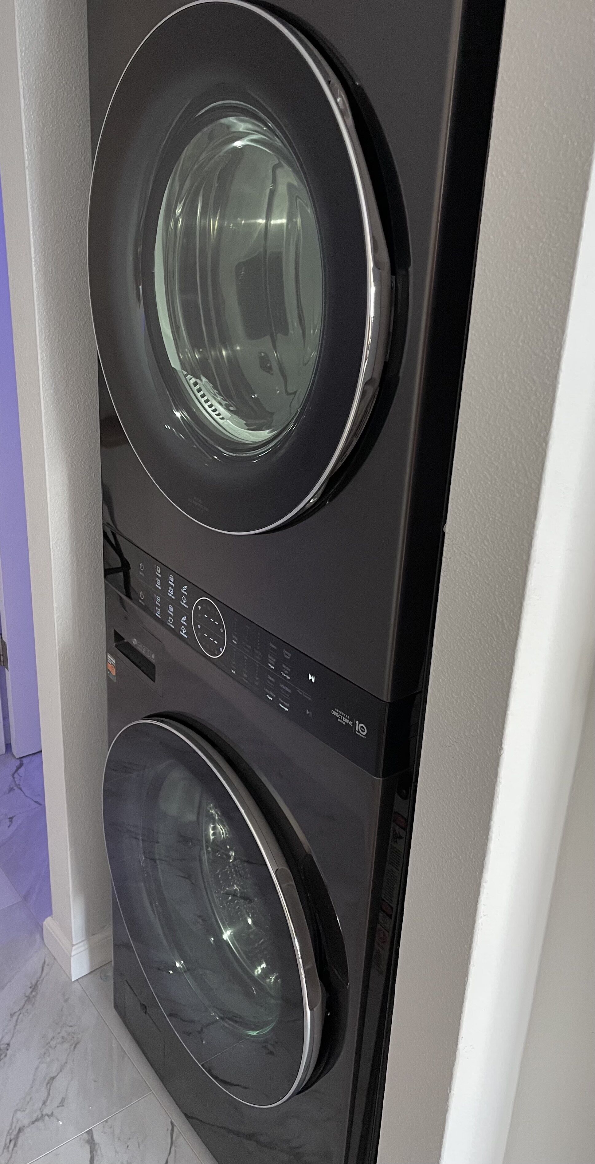 A front view of a stacked washer and dryer unit.