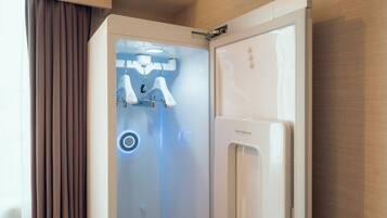 A modern bathroom with a shower, a toilet, and a vanity.