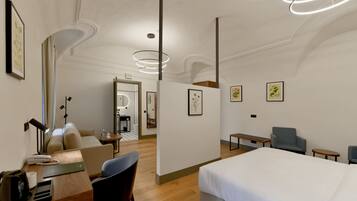 Une chambre d’hôtel moderne, équipée d’un lit, d’un bureau, de chaises et d’œuvres d’art accrochées aux murs.