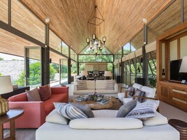 Atulya Residence | Living room | 43-inch flat-screen TV with satellite channels, TV, iPod dock