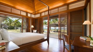 A spacious bedroom with a large bed, wooden ceiling, and a view of the beach. - Jivana Beach Villas (Takua Thung)