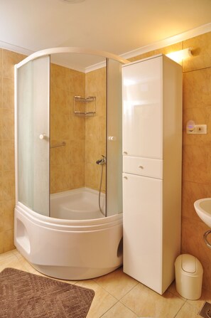 Shower, hair dryer, towels, soap
