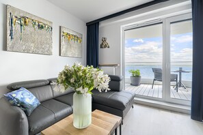 Appartement Deluxe, 1 chambre, terrasse, vue lac | Coin séjour