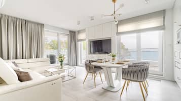 Deluxe Apartment | Living area | Flat-screen TV