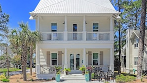 A two-story house with a balcony, a front porch, and a number '120' on the front door. - Private Pool And Gulf Views- Sugar Magnolia By Royal Destinations (Santa Rosa Beach)