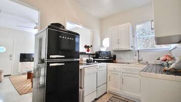 Fridge, coffee/tea maker, cookware/dishes/utensils