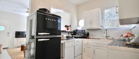 Fridge, coffee/tea maker, cookware/dishes/utensils