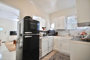 Fridge, coffee/tea maker, cookware/dishes/utensils