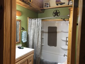 Combined shower/bathtub, hair dryer, towels, soap