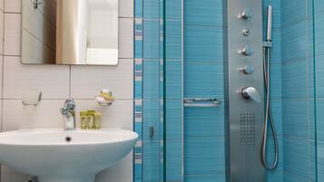 Shower, hair dryer, towels, toilet paper