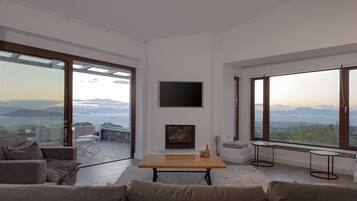 Superior Villa, Multiple Bedrooms, Private Pool, Sea View | Living area | Smart TV, fireplace, Netflix, ping pong