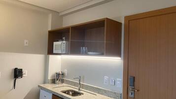 Fridge, microwave, cookware/dishes/utensils, dining tables