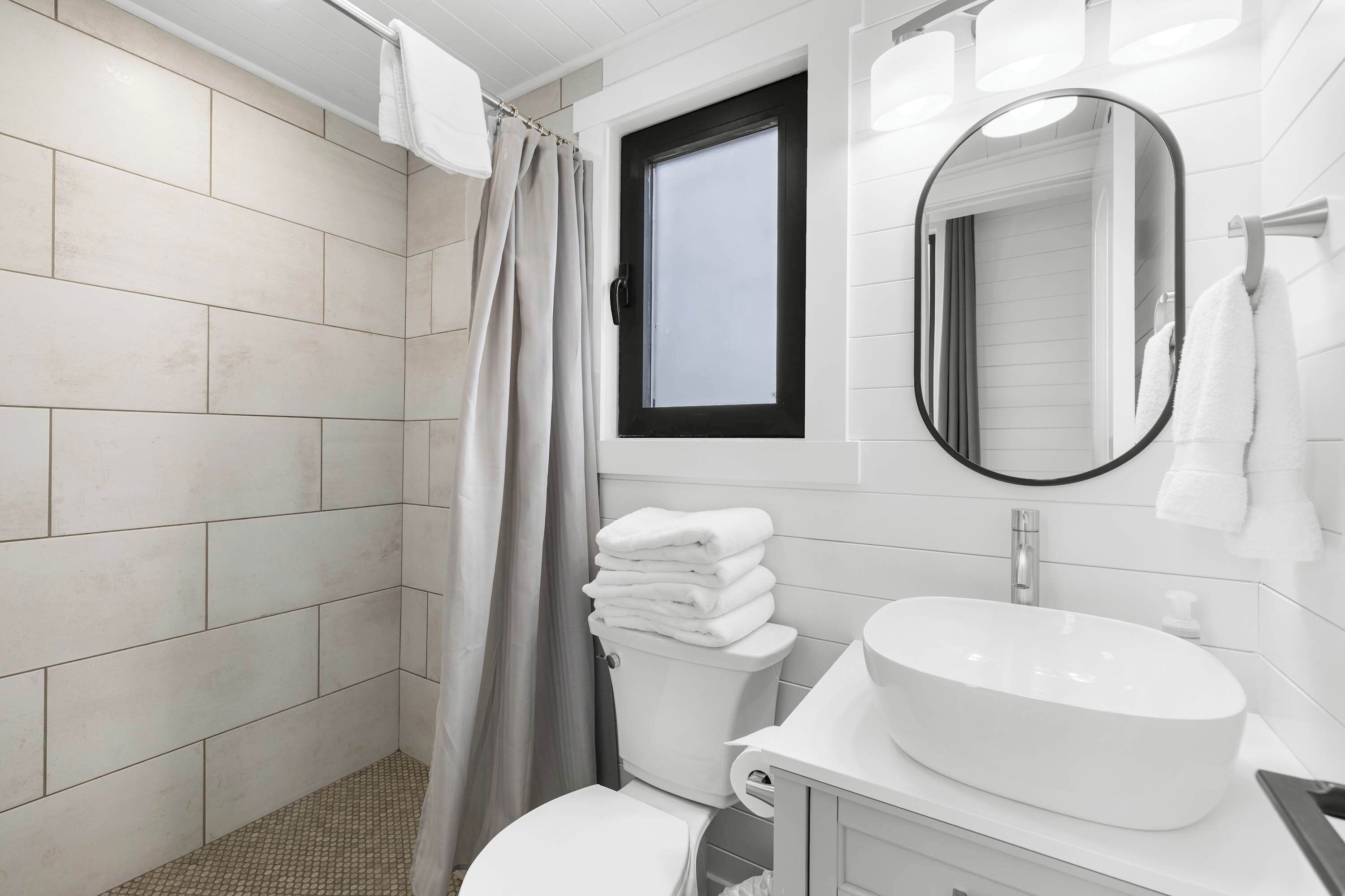 Shower, hair dryer, towels, shampoo