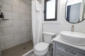 Shower, hair dryer, towels, shampoo