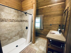 Combined shower/bathtub, hair dryer, towels, soap