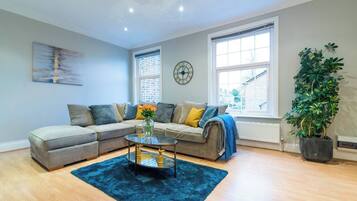 Apartment, 2 Bedrooms | Living area | TV, books