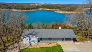A house with a large front yard and a view of a lake. - The View on Bull Shoals Lake! (Lakeview)