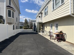 Guests can enjoy a patio area with a table and chairs.