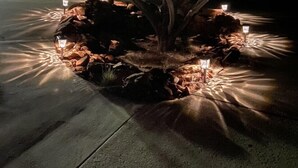A tree with a well-maintained garden bed, surrounded by small, evenly spaced lights. - A COWBOYS CASA--BEST RED ROCK VIEWS IN SEDONA -WALK TO TLAQUEPAQUE & UPTOWN-- (Sedona)