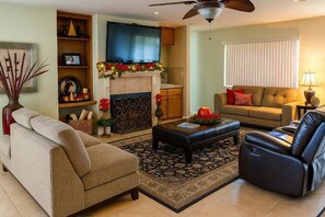 Smart TV, fireplace, books, printers