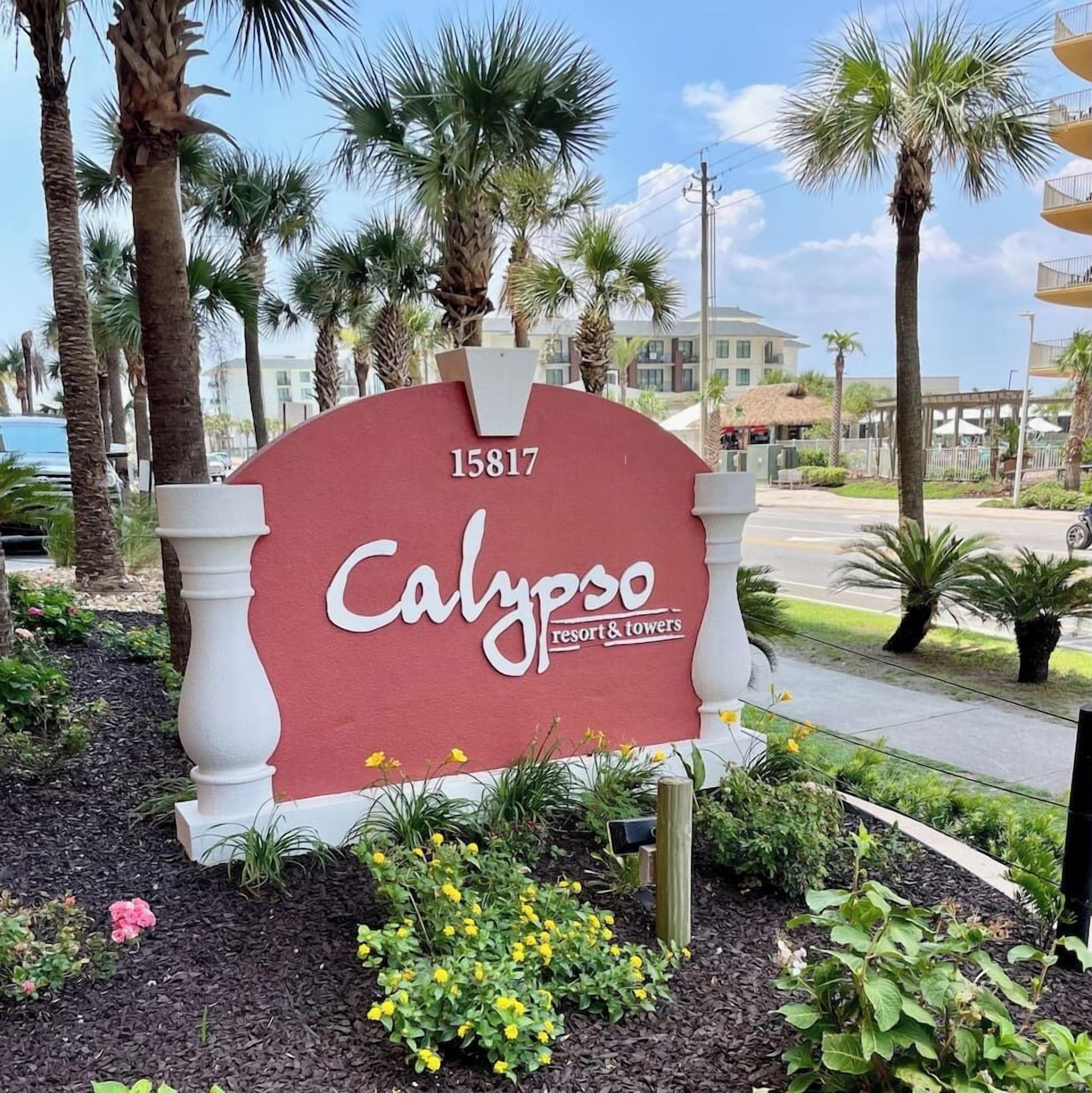 A sign for Calypso Resort & Towers with the address 15817.