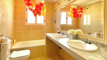 Bathtub, hair dryer, towels