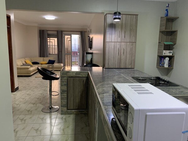 Fridge, microwave, electric kettle, cookware/dishes/utensils