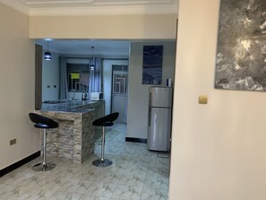 Fridge, microwave, electric kettle, cookware/dishes/utensils