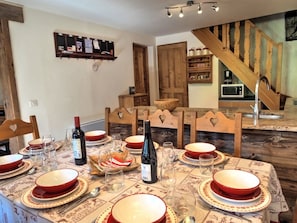 Dining area to sit 8 through to the large, fully equipped kitchen