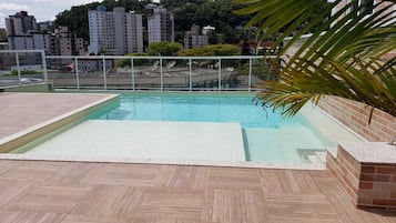 Outdoor pool, open 9:00 AM to 9:00 PM, pool umbrellas, sun loungers