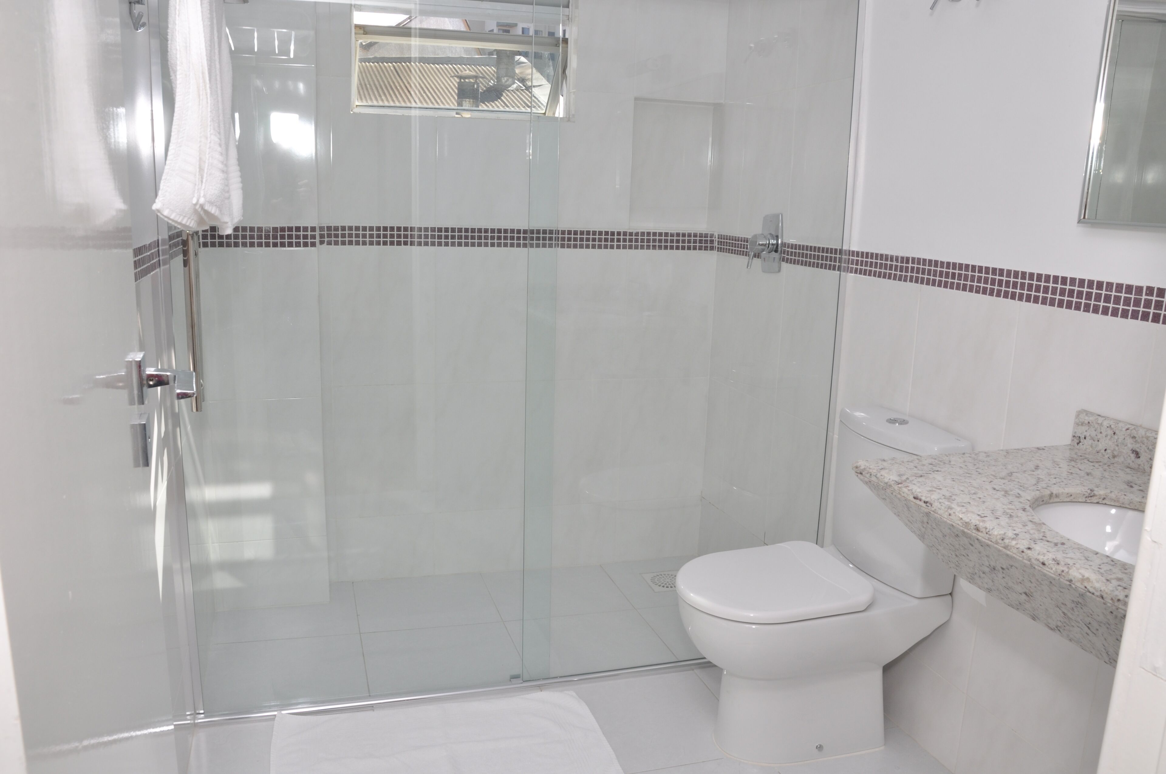 superior twin room | bathroom | shower, hair dryer, towels, soap