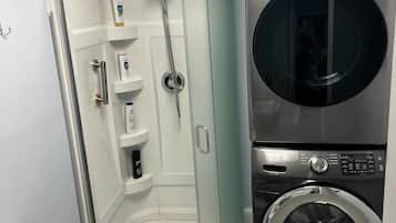 Combined shower/tub, hair dryer, towels, soap