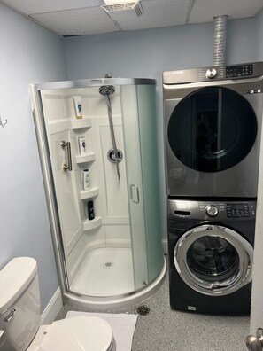 Combined shower/tub, hair dryer, towels, soap